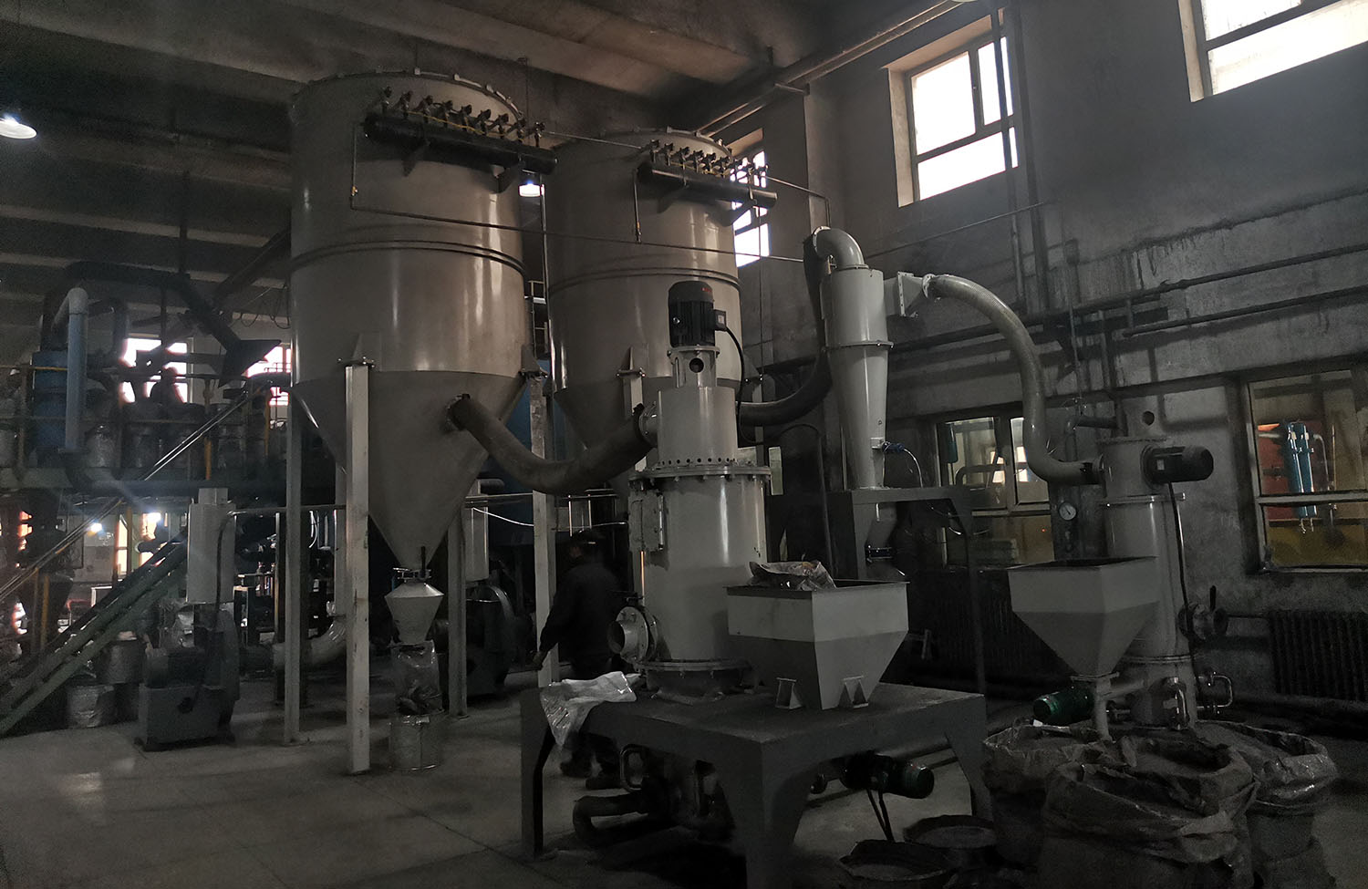 Superfine jet mill system for boron carbide processing